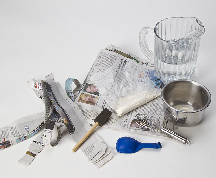 Materials: strips of newspaper, balloon, water, flour, treats