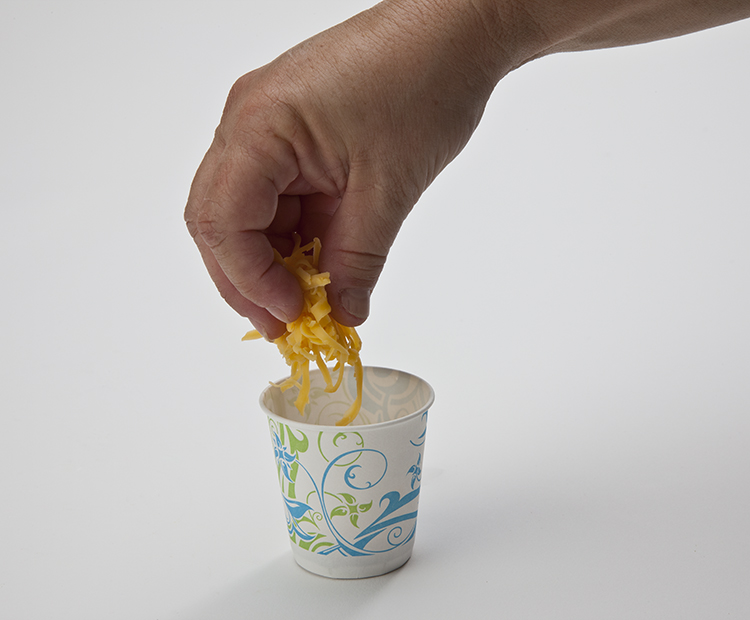 Adding cheese to cup