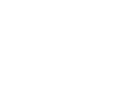 Giraffe standing next to a refrigerator